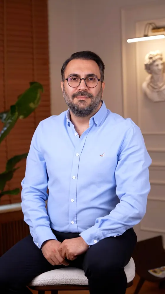 Portrait of Op. Dr. Emre Türkmen at his clinic